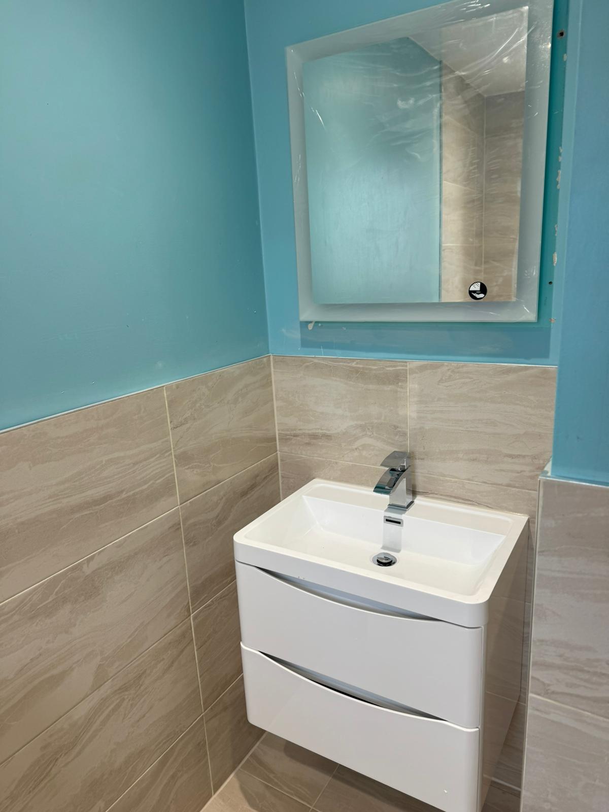 Back lit mirror and vanity unit